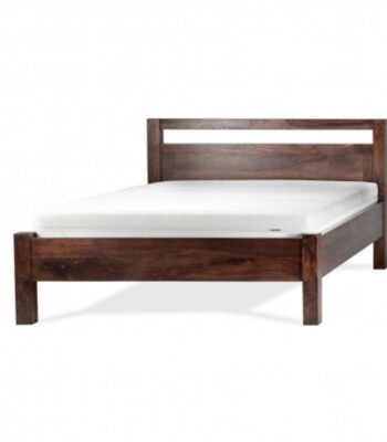 Handcrafted solid mango wood platform bed with minimalist headboard and rustic natural wood finish.